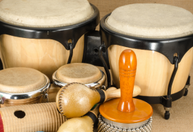 Photograph image of a group of musical percussion instruments on a table