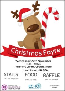 a poster for a christmas fayre event being held at The Priory Centre Leominster on 24th November 2021. The image shows a cartoon style dog reindeer character holding a red and whit candy cane sitting on a red ribbon banner.