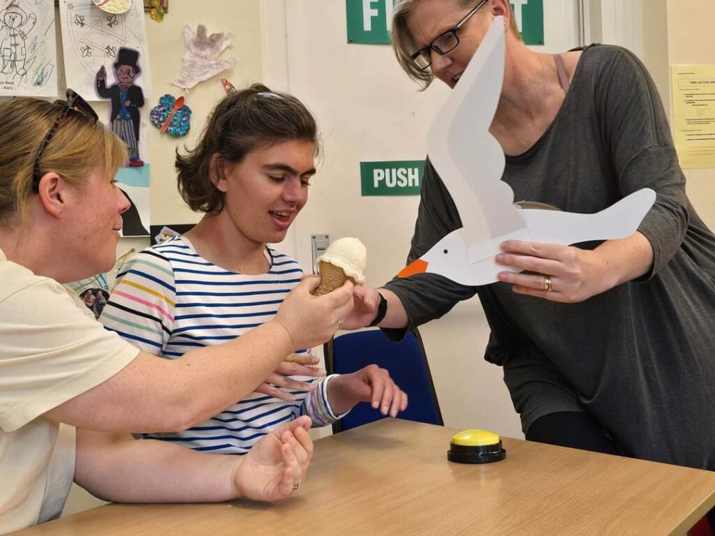 Three women with a model seagull and Icecream